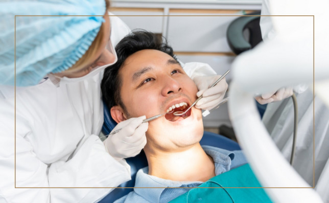 Male patient with open mouth during a dental exam