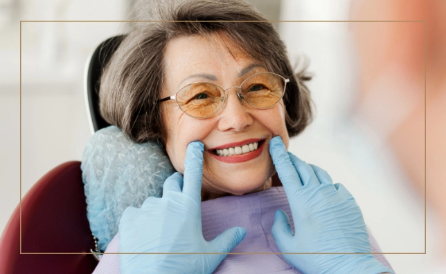 Senior woman at the dentist with a wide grin and wearing protective eyewear