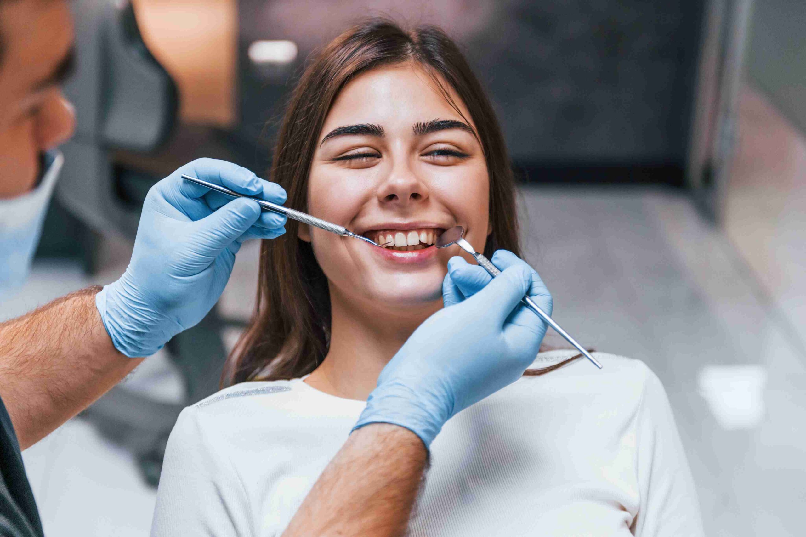 Patient smiling during a dental veneers consultation.